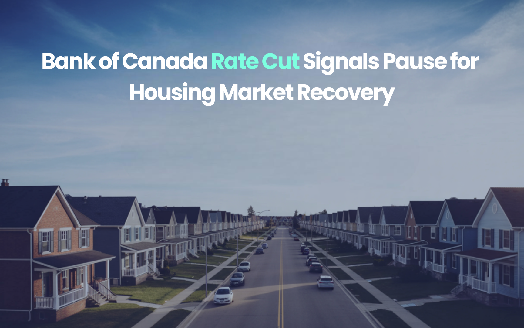 Quiet suburban street in Canada with rows of detached houses under a clear sky, symbolizing a pause in the housing market following the Bank of Canada rate cut